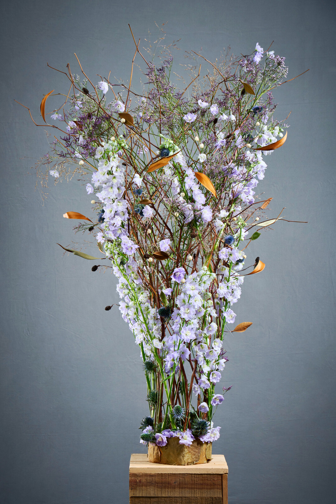 Sara-Lisa Ludvigsson created a �crown for all women�. The delicate, dry framework of twigs provides support for the delphiniums arranged in tubes. 