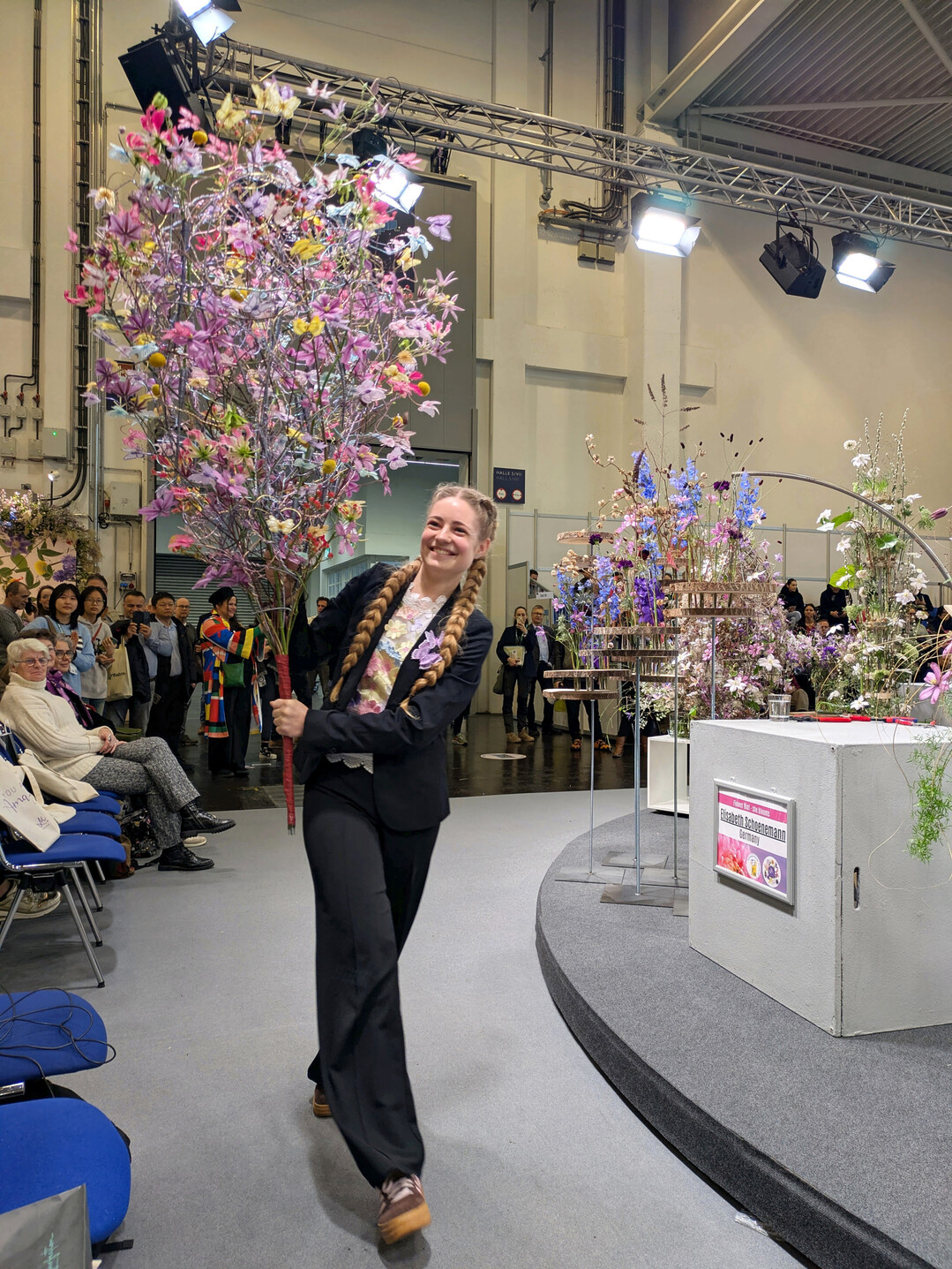 Carine Stel, Hanneke Frankema�s assistant, is carrying her oversized butterfly bouquet, which she created for Hanneke�s �Growth� show at the World Cup of Floral Art in The Hague. 